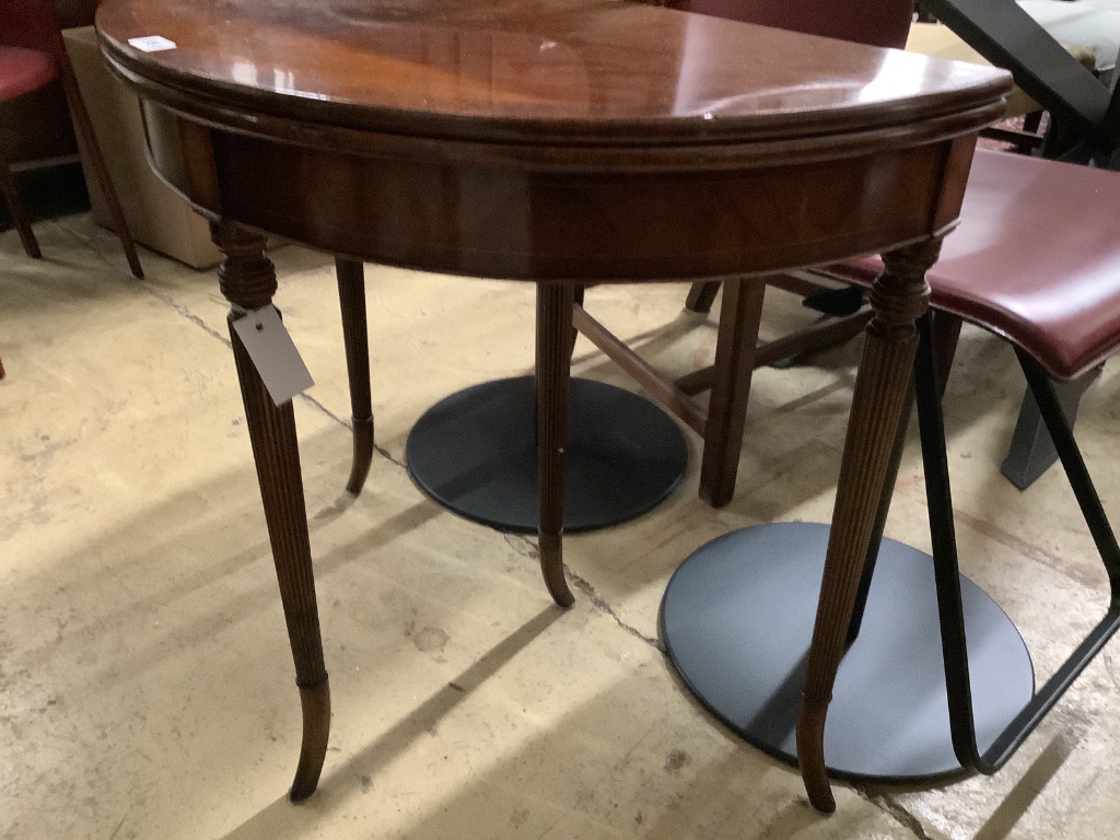 A reproduction mahogany D shape folding tea table, width 79cm, depth 39cm, height 73cm